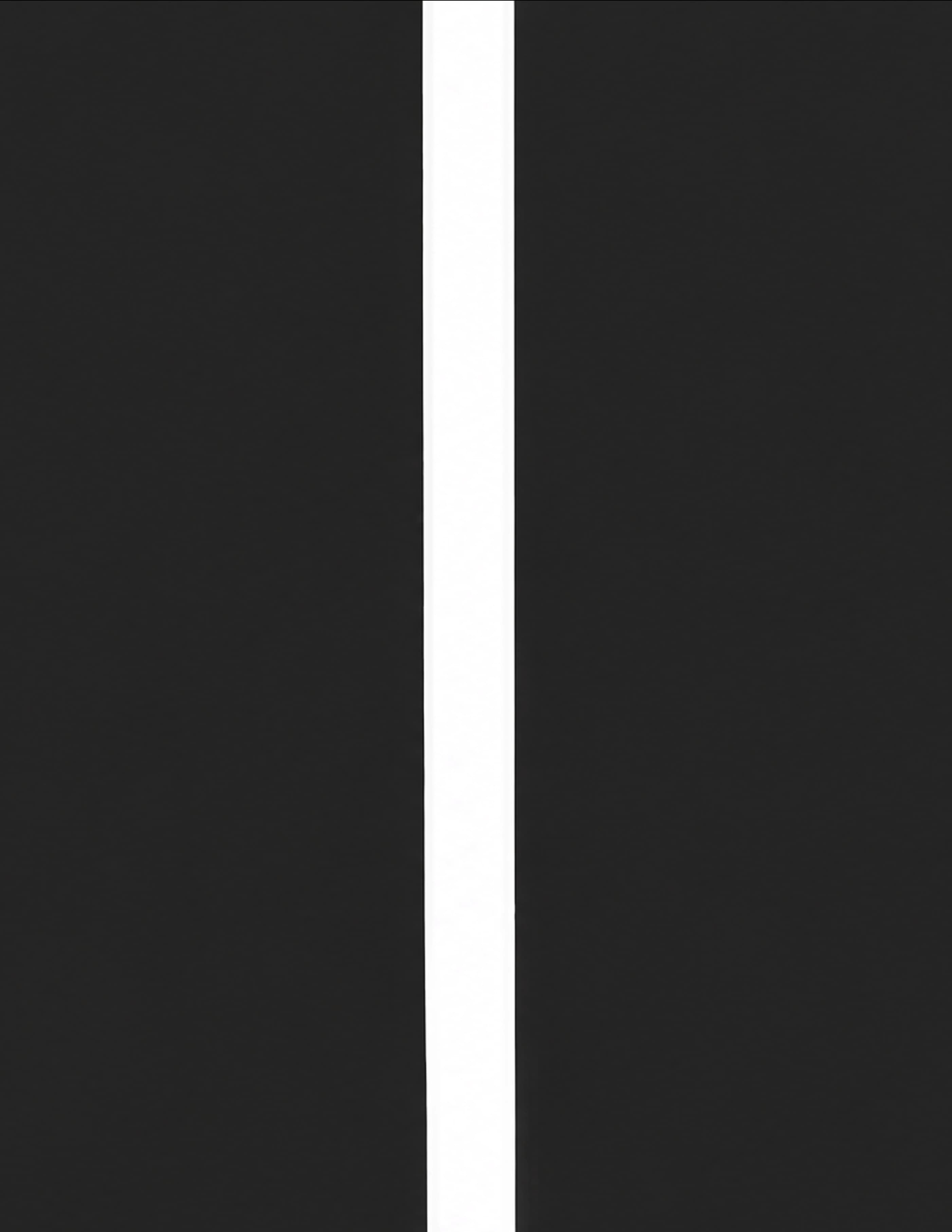 A dark wall is split by a single narrow vertical sliver of daylight.