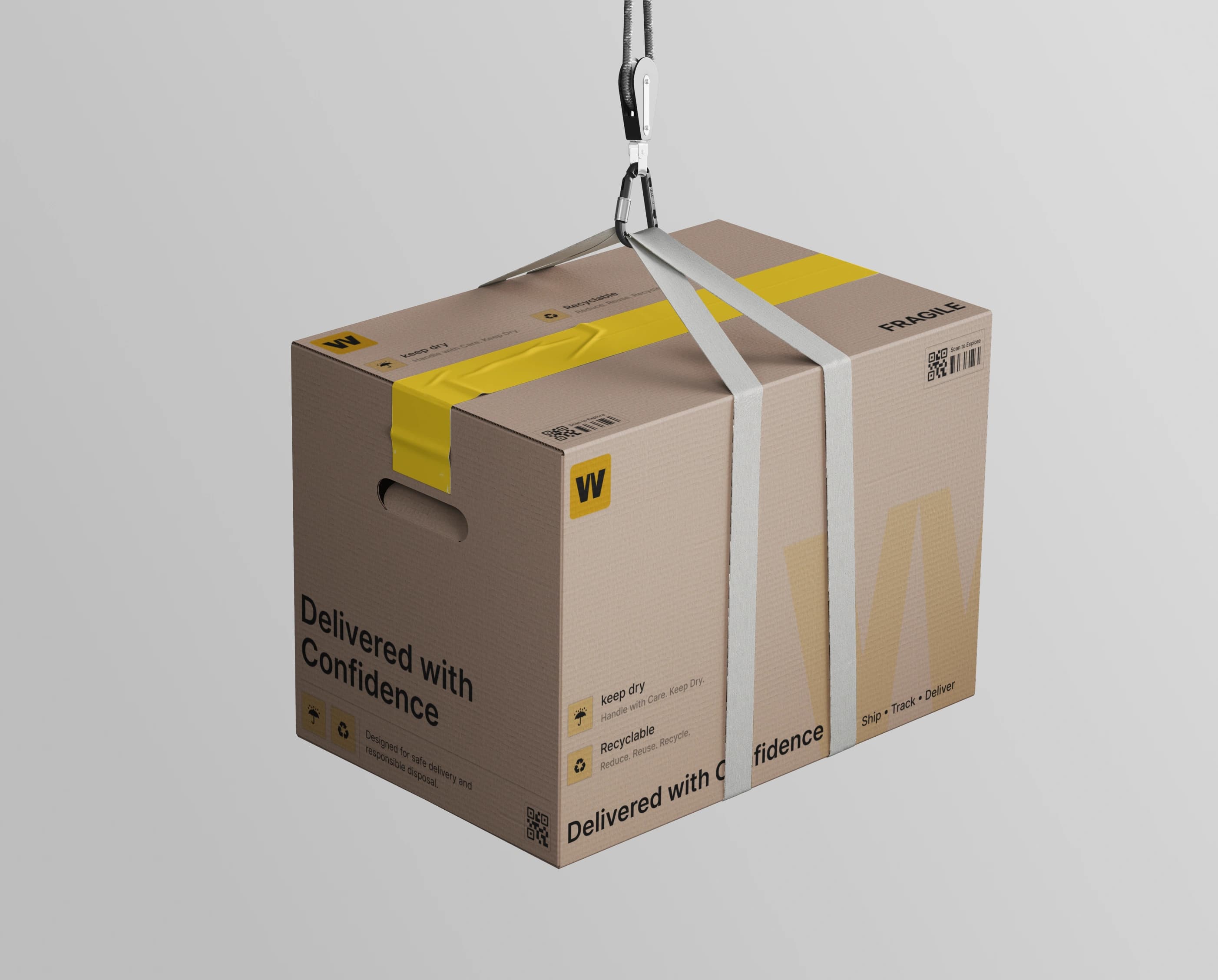 A single kraft WINCH carton strapped into a white lifting harness and suspended from a hook against a light grey studio ground, its side printed with Fragile, Keep dry and Recyclable marks.