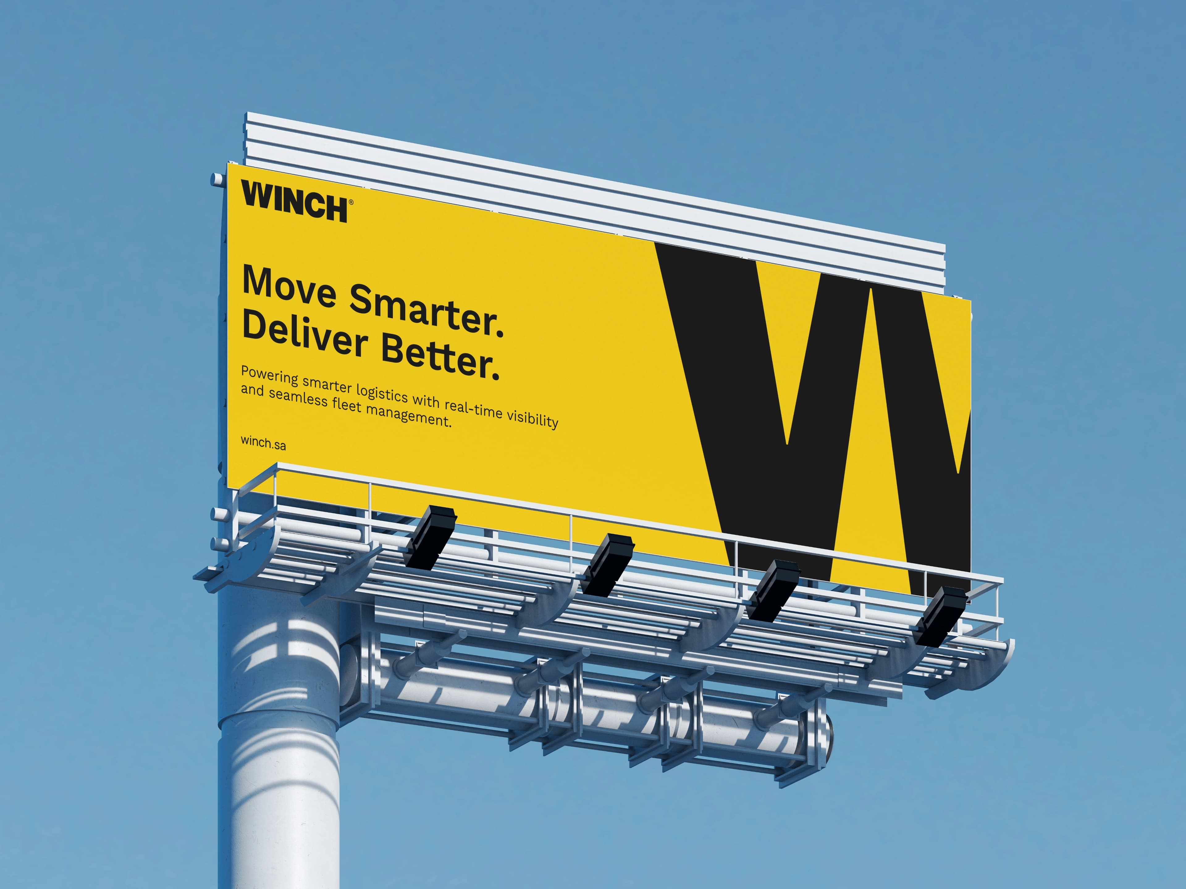 A yellow roadside billboard against a clear blue sky carrying the WINCH logo, the headline Move Smarter. Deliver Better., a line about real-time visibility and fleet management, the address winch.sa, and a large black W running off the right edge.