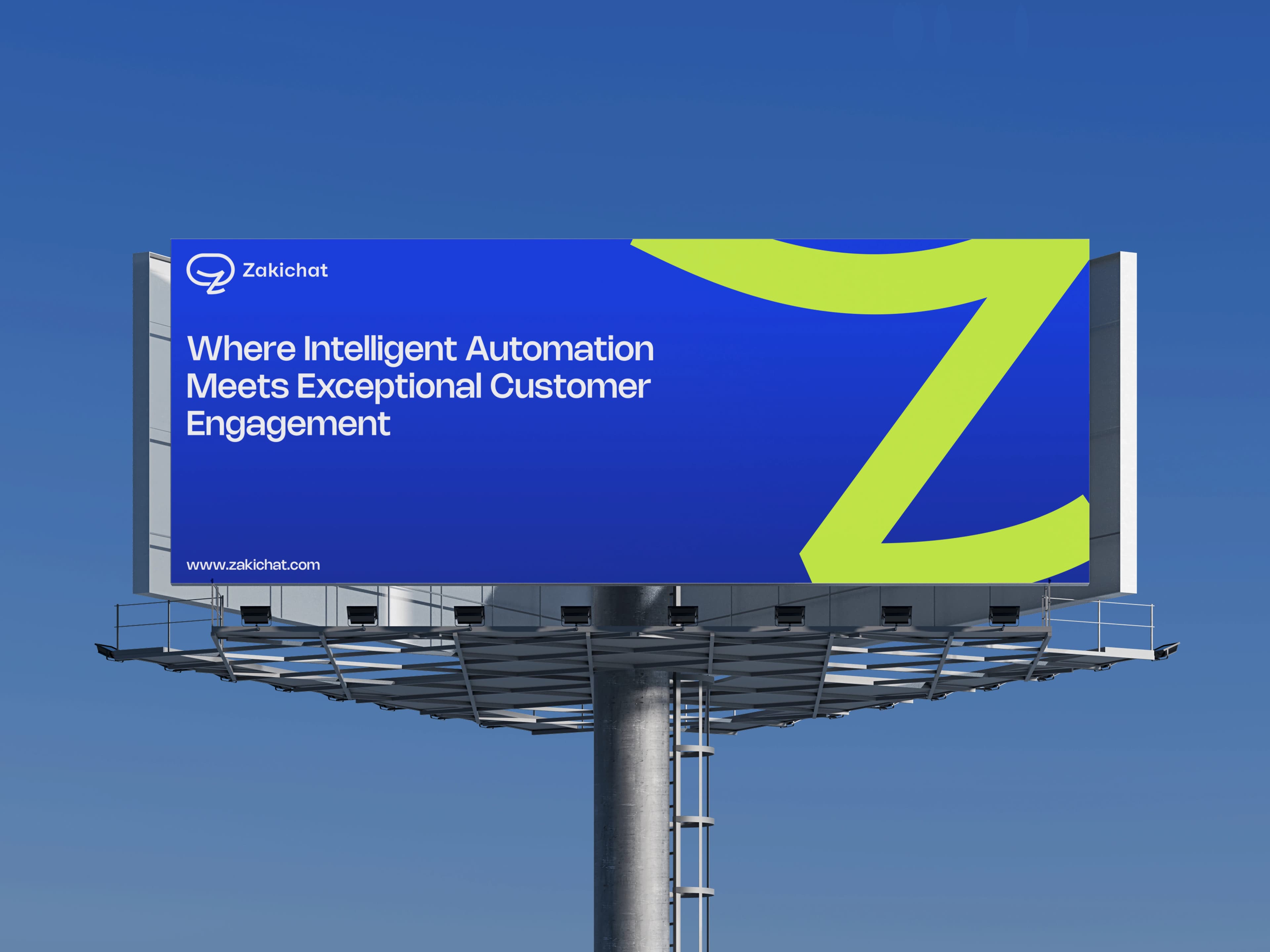 Zakichat — highway billboard A single-pole highway billboard against a clear blue sky carrying a royal-blue Zakichat creative with the lockup, the headline Where Intelligent Automation Meets Exceptional Customer Engagement, the www.zakichat.com url and an oversized fluorescent-yellow Z bleeding off the right edge.